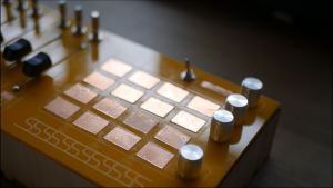 A picture of a yellow midi controller DIY self-build